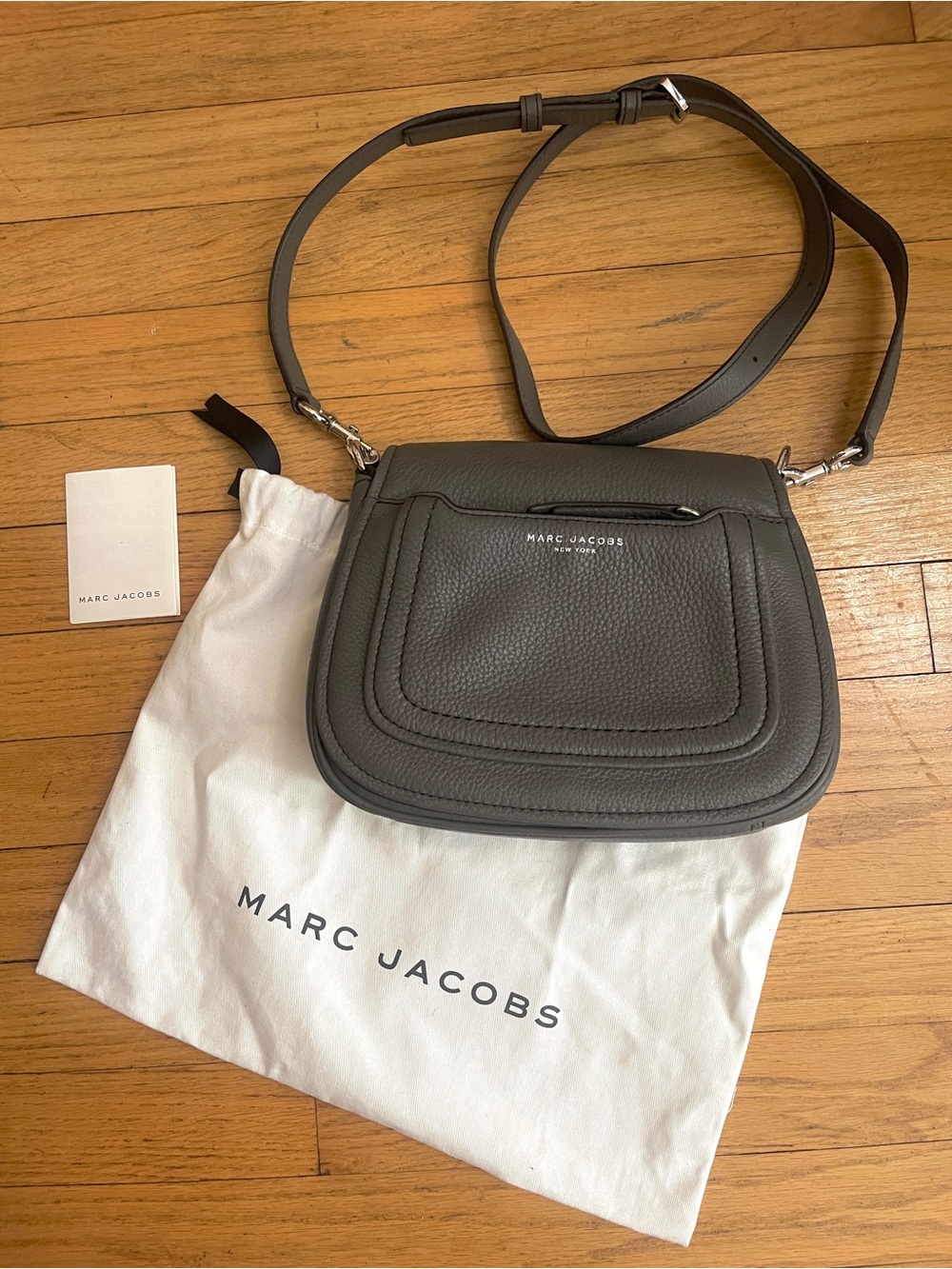 The MARC JACOBS Empire City Gray Pebbled Leather Mini Saddle Crossbody Bag
